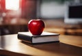 AI generated illustration of a fresh, ripe red apple atop a stack of a leather-bound book Royalty Free Stock Photo