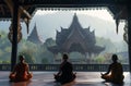 a number of people sitting on a floor in meditation area