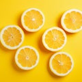 AI generated illustration of halved lemons on a vibrant yellow background