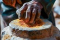 AI generated illustration of hands using a traditional stone grinder to prepare spices Royalty Free Stock Photo