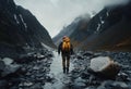 AI generated illustration of a hiker with a yellow backpack on the rock and foggy mountain path Royalty Free Stock Photo