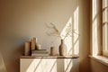 Home interior. Living room interior with books, ceramic vase with dried flowers and window.