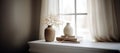 Home interior. Living room interior with books, ceramic vase with dried flowers and window.