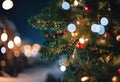 christmas lights on a tree near a street at night during the winter time Royalty Free Stock Photo