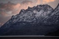 AI generated illustration of A majestic snow-capped mountain range set against a cloudy sky Royalty Free Stock Photo