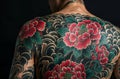 a man with some colorful tattoos on his back and arms Royalty Free Stock Photo