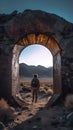 man walking through a stone arch in an empty desert area Royalty Free Stock Photo