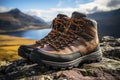 AI generated illustration of a pair of brown hiking boots on a rocky hillside