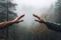 AI generated illustration of a pair of hands reaching outwards in a tranquil forest setting Royalty Free Stock Photo