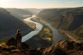 AI generated illustration of a person standing on a hill above a river valley with trees and cliffs Royalty Free Stock Photo