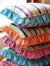 AI generated illustration of a pile of decorative pillows with frilly edges