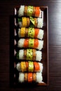 AI generated illustration of a plate of assorted sushi rolls on a wooden table