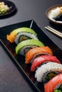 AI generated illustration of a plate of assorted sushi rolls on a wooden table