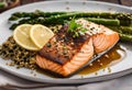 a plate with salmon, asparagus and rice on it