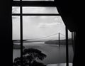 AI generated illustration of a scenic view of a bridge seen from inside a window
