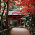 red trees and red torimi shrine in Japan with stone walkway and stone wall