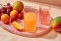 AI generated illustration of a selection of fresh fruit and glasses of juice on the table Royalty Free Stock Photo