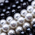 several pearls, black and white are on the table ready for sale