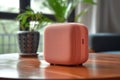 AI generated illustration of a sleek and portable bluetooth speaker in a delightful shade of pink