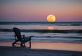 AI generated illustration of a solitary chair perched atop a sandy beach with the moon