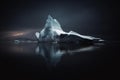 an iceberg is floating on the water in the dark