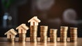 AI generated illustration of stacks of golden coins with house miniatures, real estate concept Royalty Free Stock Photo