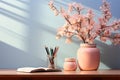 AI-generated illustration of a table with a cherry blossom vase, open book and pencils on it Royalty Free Stock Photo