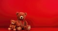 three teddy bears sitting on the floor with one red wall Royalty Free Stock Photo