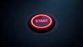 Vibrant red illuminated circular START button set flush on a textured dark panel Royalty Free Stock Photo