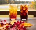 AI generated illustration of Two glasses of iced tea on a table with a blurry background Royalty Free Stock Photo