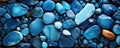 AI generated illustration of a vibrant display of precious blue gems and rocks on a black surface