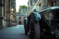 AI generated illustration of a vintage car parked on a narrow street with old buildings Royalty Free Stock Photo