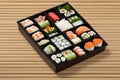 a small tray with many different sushi on it's sides Royalty Free Stock Photo