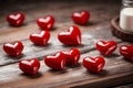 Valentine week Background of images of glossy red heart-shaped objects on a wooden background with white paint.