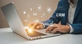 Ai generated image of businessman using crm software on laptop for data analysis and management Royalty Free Stock Photo