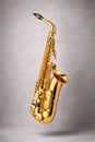 Golden Saxophone Floating In Studio Light For Jazz And Modern Music Themes Royalty Free Stock Photo