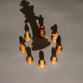 AI-Generated Image of Chess Pieces Forming a Circle with Cast Shadow of a King Royalty Free Stock Photo