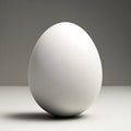 White unpainted plain egg on light grey background with empty space behind