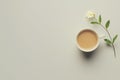 Coffee cup and flower on light grey background with minimalist gold text Good Morning Royalty Free Stock Photo
