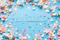 Congratulations text on pastel blue background with confetti Royalty Free Stock Photo