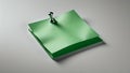 Green sticky note pinned to a surface with a pushpin Royalty Free Stock Photo