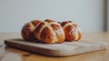 Easter. Good Friday. Hot cross buns on a wooden board on a wooden table.