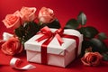 Valentine week Background a heart-shaped gift box wrapped with a white and red ribbon, accompanied by three red roses . Royalty Free Stock Photo