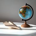AI Generated: Globe and Paper Airplane on White Table