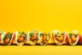 Fish Tacos tasty fast food street food for take away on yellow background