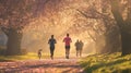 Joggers Running Through a Park in Springtime Royalty Free Stock Photo