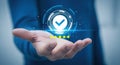 Ai generated image of hand with glowing blue checkmark verification symbol Royalty Free Stock Photo