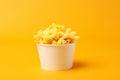 Mac and Cheese tasty fast food street food for take away on yellow background