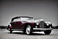 Maroon classic car on black and white background