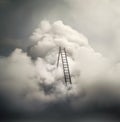 Path to Heaven. Ladder leading to the sky, conceptual image with dramatic clouds. Royalty Free Stock Photo